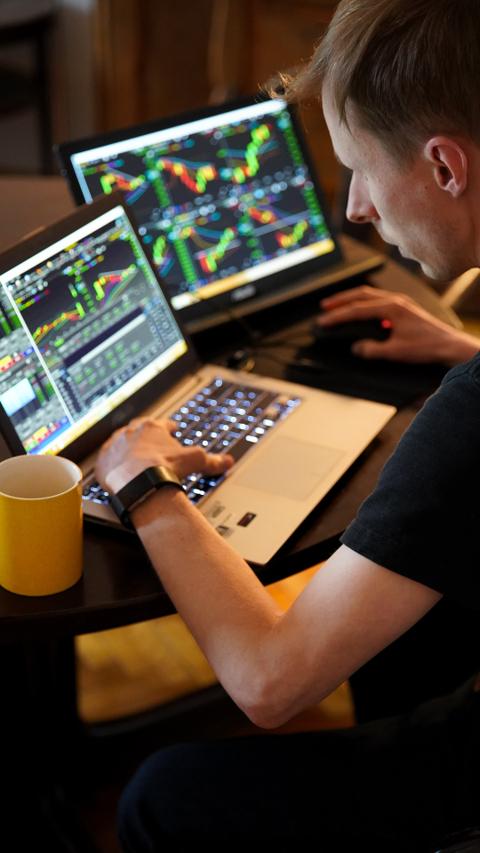 Male coding on computer